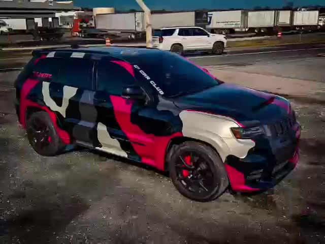 Jeep Grand Cherokee wrapped in a pink, black, white and gray camo pattern