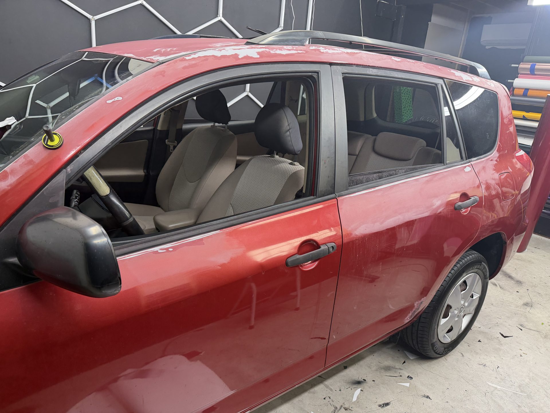 SUV being prepared for work inside the shop