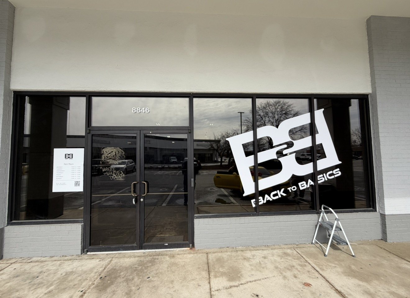 Cut vinyl logo graphics installed on a commercial storefront window